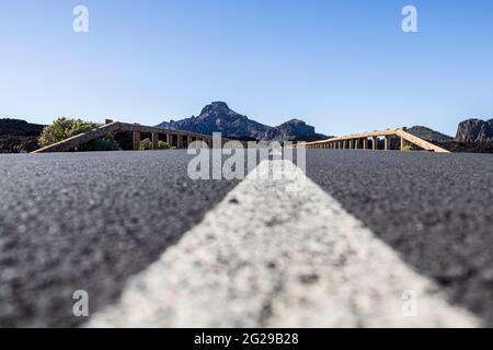 Low angle view along the tarmac surface of the TF38 road through the Las Canadas del Teide National Park, Tenerife, Canary Islands, Spain Stock Photo