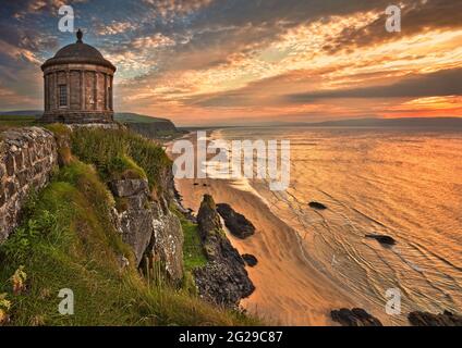 The Mussenden Temple was built as a summer library in 1785 in the grounds of Downhill Demesne near the town of Castlerock on the Northern Ire coast. Stock Photo
