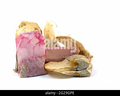 Used tea bags against white background Stock Photo