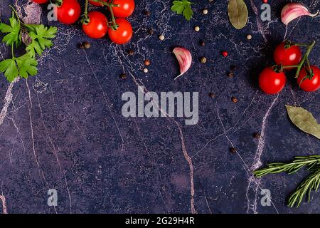 Food background - fresh vegetables and various spices. Cooking concept. Top view. Stock Photo