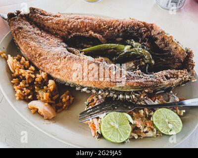 Fried fish. fried smooth fish. Mullet, Flat-headed mullet. Mullet. mullet fish, serrano peppers, lemons,. sea food. Seafood , Food, food, Meals, food. Stock Photo