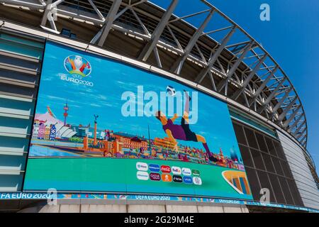 Wembley Stadium, Wembley Park, UK. 9th June 2021.   EURO 2020 graphics on the rear of Wembley Stadium.  Postponed by a year as the Coronavirus pandemic hit worldwide in 2020, UEFA European Football Championship starts on 11th June 2021, with Wembley Stadium hosting it's first match, England v Croatia, on 13th June 2021. Amanda Rose/Alamy Live News Stock Photo