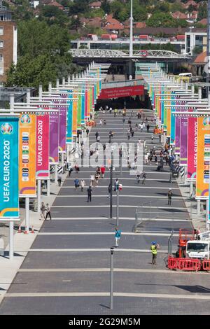 Wembley Stadium, Wembley Park, UK. 9th June 2021.  View down 'Wembley Way', flanked with clourful banners ahead of UEFA European Football Championship. Postponed by a year as the Coronavirus pandemic hit worldwide in 2020, the tournament starts on 11th June 2021, with Wembley Stadium hosting it's first match, England v Croatia, on 13th June 2021. Amanda Rose/Alamy Live News Stock Photo