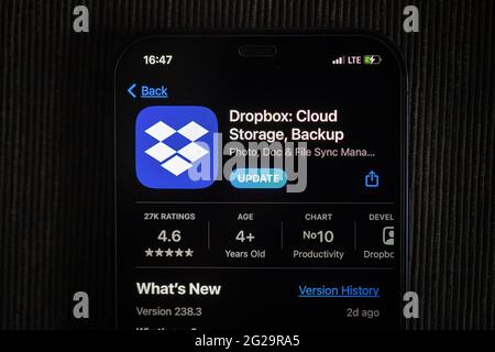 Dropbox app in the apple App Store seen on an iPhone 12 screen Stock Photo