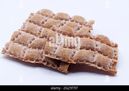crumbled hard bread on white background Stock Photo
