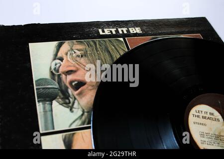 Let it Be is a record by the English rock band The Beatles. This music album is on a vinyl record LP disc. Psychedelic pop music. Album cover Stock Photo