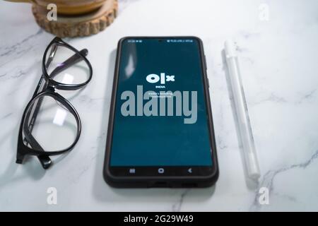 Flatlay shot of mobile phone showing the logo of olx indias largest second  hand reseller marketplace similar to  and craigslist in India asia –  Stock Editorial Photo © amlanmathur #477590410