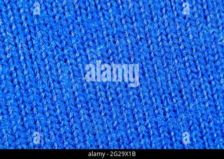 Blue fabric texture of natural cotton or linen textile material, warm blue sweater cloth close up, high resolution background Stock Photo