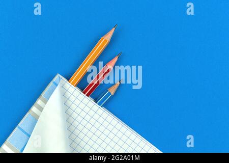 Student prepares for school days concept flat lay background with blue table, top view Stock Photo