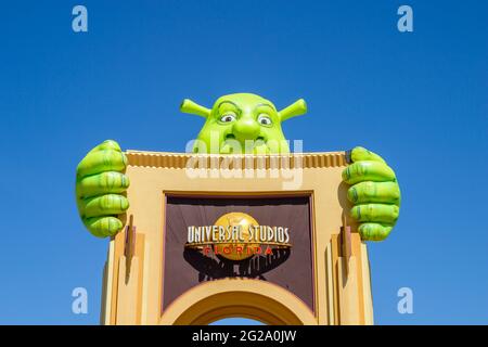 Entrance gate with Shrek at the Universal Studios theme park, Orlando, Florida, USA on a sunny day with clear, cloudless blue sky Stock Photo