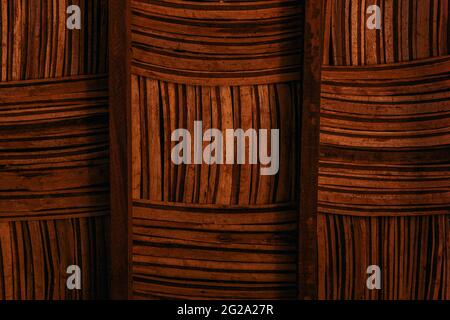 Closeup brown striped surface of braided bamboo piled up rugs Stock Photo