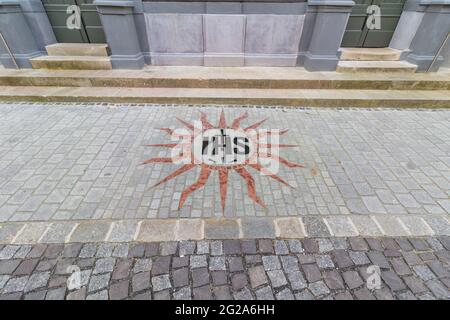 Modern IHS Christogram mosaic in the pavement in front of Szent Gyorgy templom (St Saing George Church), Sopron, Hungary Stock Photo