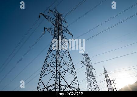 low view high voltage power line at the evening Stock Photo