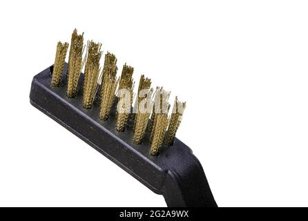 A small copper brush. Accessories used at home and in a locksmith's workshop. Isolated background. Stock Photo