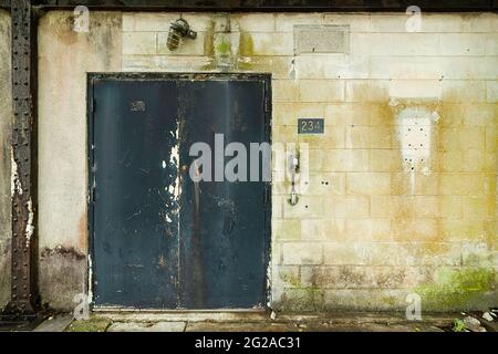 Old battered rusty doors on an abandoned military building in Virginia Stock Photo