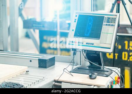 Computer monitor for control CNC machine for cutting wood. Modern woodwork industry. Stock Photo