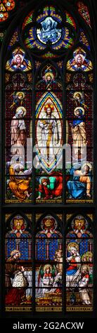 Stained-glass window depicting the Transfiguration of Jesus Christ. Votivkirche – Votive Church, Vienna, Austria.
