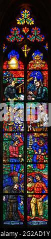 Stained-glass window depicting Jesuit fathers as missionaries in China. Votivkirche – Votive Church, Vienna. Stock Photo