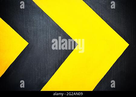 Yellow and black arrows - street sign Stock Photo