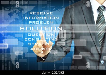 Businessman touching SOLUTION sign on virtual screen Stock Photo