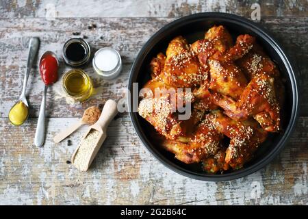 Chicken wings baked with sesame seeds. Buffalo Wings. Stock Photo