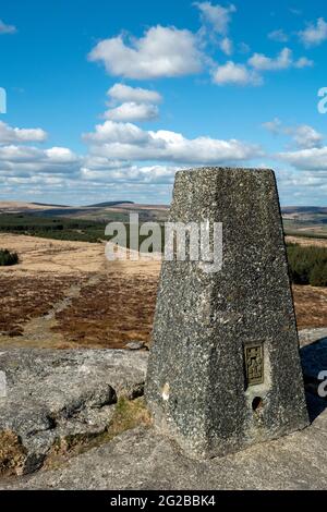 Trig point at Bellever Tor on Dartmoor, Devon Stock Photo