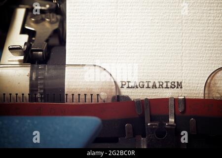 The word plagiarism written with a typewriter. Stock Photo