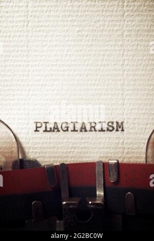 The word plagiarism written with a typewriter. Stock Photo