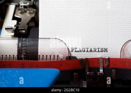 The word plagiarism written with a typewriter. Stock Photo