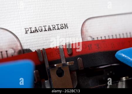 The word plagiarism written with a typewriter. Stock Photo