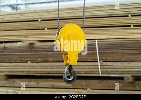 Overhead beam crane hook in factory warehouse, close up. Stock Photo