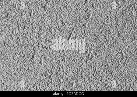 white textured background of filler paste applied with putty knife in irregular dashes and strokes Stock Photo