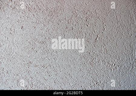white textured background of filler paste applied with putty knife in irregular dashes and strokes Stock Photo
