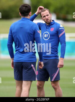 England's Harry Maguire and Harry Kane (right) during a training ...