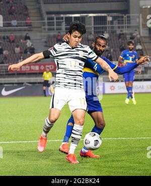 Goyang, South Korea. 9th June, 2021. South Korea's team player Song Min-Kyu (L), and Sri Lanka player Duckson, fight for the ball during a 2022 FIFA World Cup Asia qualification Round 2 Group H match between South Korea and Sri Lanka at the Goyang Stadium in Goyang, South Korea on June 09, 2021. South Korea win 5-0. (Photo by Lee Young-ho/Sipa USA) Credit: Sipa USA/Alamy Live News Stock Photo