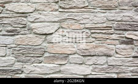 Stone light wall texture background as backdrop or texture. Part of a stone wall. Copy space Stock Photo