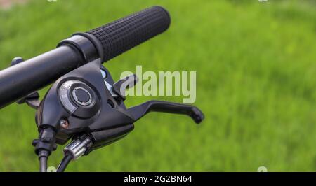 Mountain bike steering wheel on green 