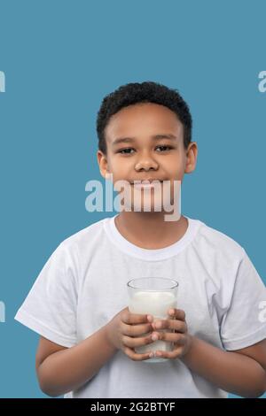 Cute friendly boy with glass of milk Stock Photo