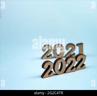 Banner 2022. Numerals 2022 on blue background. Wooden digits 2022. Stock Photo