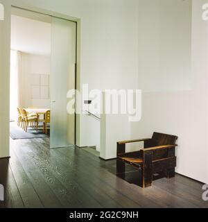 Wooden chair in hallway by dining room Stock Photo