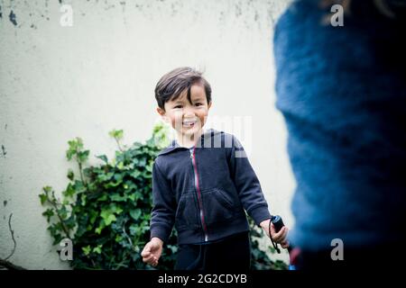 Smiling boy looking away Stock Photo