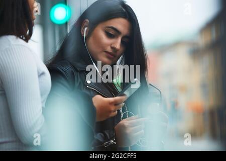 Young woman using cell phone Stock Photo