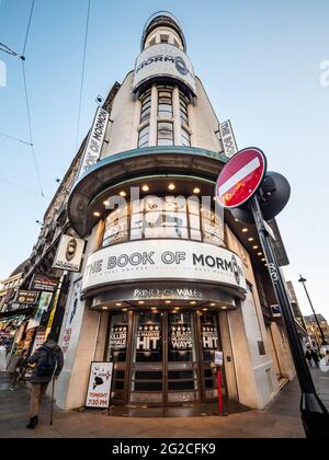 The Prince of Wales Theatre, West End, London. Low, wide angle view of the façade to the venue showing the play 'The Book of Mormon'. Stock Photo