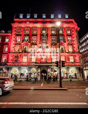 Fortnum & Mason, London. The night façade to the exclusive Piccadilly department store decorated and illuminated as a Christmas advent calendar. Stock Photo