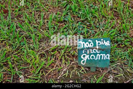 Sign board on the public square asking do not step on the grass, in portuguese language Stock Photo