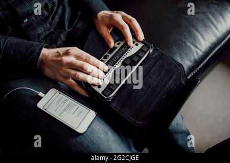 Man using Braille keyboard Stock Photo