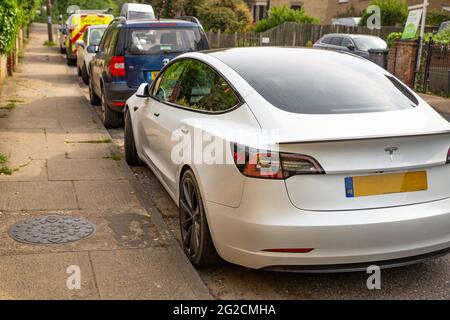 Woodbridge Suffolk UK June 04 2021: A Tesla Model S parked up within a busy urban environment Stock Photo