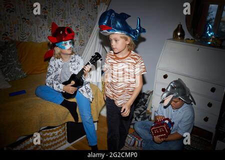 Children playing in bedroom Stock Photo