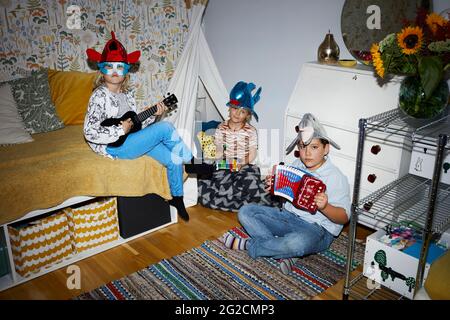 Children playing in bedroom Stock Photo