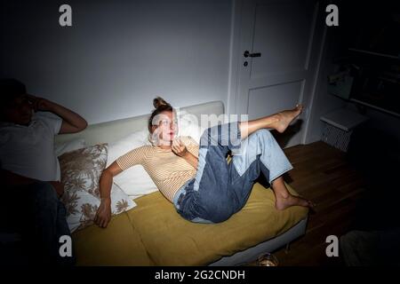 Woman relaxing on sofa Stock Photo